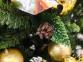 Yellow christmas toys on the tree. Golden christmas background of defocused lights with decorated tree Royalty Free Stock Photo