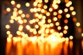 Yellow Christmas Tree Bokeh on black background of defocused glittering lights, Christmas background pattern concept Royalty Free Stock Photo