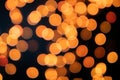 Yellow Christmas Tree Bokeh on black background of defocused glittering lights, Christmas background pattern concept Royalty Free Stock Photo