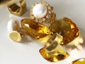 Yellow citrine natural white pearl and gold rings on white background fashion bijuteria women luxury jewelry accessory copy space Royalty Free Stock Photo
