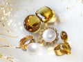 Yellow citrine natural white pearl and gold rings on white background fashion bijuteria women luxury jewelry accessory copy space Royalty Free Stock Photo