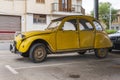 Yellow Citroen 2 CV car parked on the street