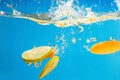 YELLOW citrus SPLASHING IN WATER