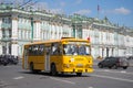 Yellow city bus LiAZ-677 in the background of the Winter Palace. Parade of petrotransport in Saint-Petersburg