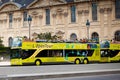 Yellow city sightseeing bus Neoplan on Paris city street. Royalty Free Stock Photo