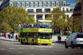 Yellow city sightseeing bus Neoplan on Paris city street. Royalty Free Stock Photo