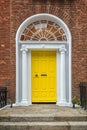 Yellow classic door in Dublin, example of georgian typical architecture of Dublin , Ireland