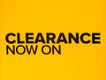 Yellow clearance sale sign in retail store. Clearance sign in a clothing store. Seasonal discount offer in store Royalty Free Stock Photo