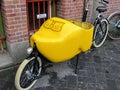 A yellow clog bicycle used as a form of transport in Amsterdam