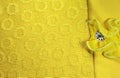 Yellow cloth with stitched flower