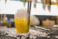 A yellow cocktail on glass with ice grain Royalty Free Stock Photo