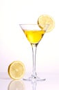 Yellow cocktail with lemon