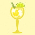 Yellow cocktail with lemon, lime, rosemary in stemware glass. Lemon juice with rum Royalty Free Stock Photo