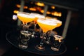 Colourful cocktails served in nightclub with nice bokeh