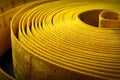 Yellow coiled measuring tape close up view
