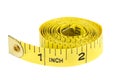 Yellow coiled tape measure on white Royalty Free Stock Photo