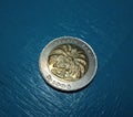 Yellow coin rupiah from indoneia on top view in 1992 year