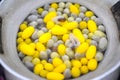 Yellow color Boiling cocoon silkworm in a pot. Royalty Free Stock Photo