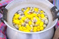 Yellow color Boiling cocoon silkworm in a pot. Royalty Free Stock Photo