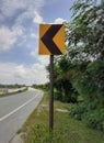 Yellow color left curve sign plate at the highway Royalty Free Stock Photo