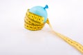 Yellow color measuring tape and a balloon Royalty Free Stock Photo