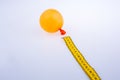 Yellow color measuring tape and a balloon Royalty Free Stock Photo