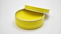 Yellow color pomade with aluminium tin can isolated with white background Royalty Free Stock Photo