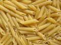 Yellow color raw Penne rigate Royalty Free Stock Photo