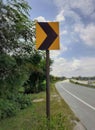 Yellow color right curve sign plate at the highway Royalty Free Stock Photo