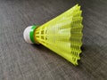 Yellow color shuttlecock isolated with grey background