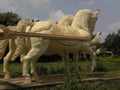 Bangalore, Karnataka, India - January 1, 2009 Yellow color statue of horses attached to a chariot