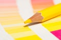 Yellow colored pencils and color chart of all colors Royalty Free Stock Photo