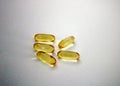 Yellow colored soft gelatin pharmaceutical transparent capsules in cluster