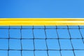 yellow colored summer games ball background beach volleyball or tennis net against blue sky for sport events. copyspace. copy Royalty Free Stock Photo