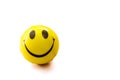 an yellow colored toy smiley with the white background