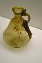 Yellow coloured ancient glass jugglet with ribbed handle, conical shape, possibly from Cyprian manufactures