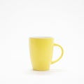 yellow coloured ceramic coffee cup in a white background Royalty Free Stock Photo