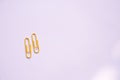 Yellow Coloured paper clips on a white background Royalty Free Stock Photo