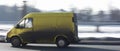 Yellow commercial van on the road driving fast Royalty Free Stock Photo
