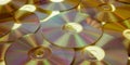 Yellow compact discs background warm Cd Dvd Blue ray laid out on a flat surface Royalty Free Stock Photo