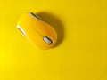 yellow computer mouse on yellow background Royalty Free Stock Photo