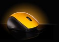 Yellow computer mouse on a black background Royalty Free Stock Photo