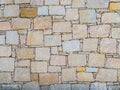 Texture of yellow concrete wall with large and small bricks in mozaic pattern Royalty Free Stock Photo
