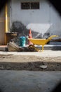 Yellow construction cart, vertical park in construction site.