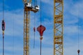 Yellow construction cranes on blue sky backgrounds Royalty Free Stock Photo