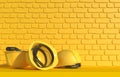 Yellow construction helmet on a background of a yellow brick wall. Monochrome illustration with copy space. Builder Work Uniform.