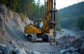 Yellow construction machine on granite rock at road construction site. Drilling machine boring holes for blasting. Roadwork Royalty Free Stock Photo
