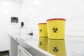 Yellow containers locating on desk Royalty Free Stock Photo