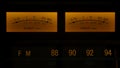 Yellow controls dashboard on an old analog radio. Close up of a scale with an arrow measuring signal power on vintage Royalty Free Stock Photo