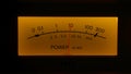 Yellow controls dashboard on an old analog radio. Close up of a scale with an arrow measuring signal power on vintage Royalty Free Stock Photo